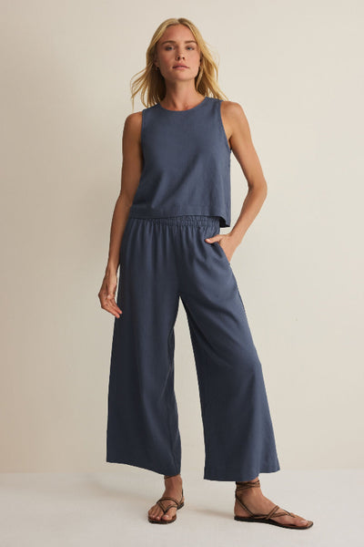 Vintage indigo Sloane linen tank top and Scout wide-leg linen pants as a matching set, styled with strappy sandals, full length view.