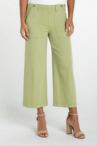 Lotus green wide leg crop utility pants with front stitch pockets and set-in waistband, front view.
