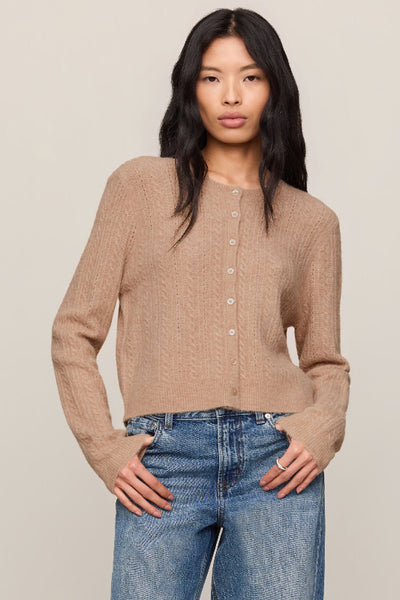 Front view of Z Supply Medina Pointelle Cardigan in Macaroon with a crew neck, long sleeves, and button front. Z Supply Medina Pointelle Cardigan; Z Supply Macaroon cardigan; Z Supply ZW263444; women's pointelle cardigan; women's button front cardigan; crew neck knit cardigan; long sleeve pointelle sweater; women's neutral cardigan; cropped pointelle cardigan; textured knit cardigan.