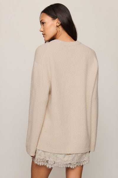 Back view of Z Supply Chill Mode Sweater in Frosted Pearl showing its long sleeves and straight hem. Z Supply Chill Mode Sweater; Z Supply Frosted Pearl sweater; Z Supply ZW264778; women's fluffy knit sweater; women's fuzzy crewneck sweater; long sleeve neutral sweater; relaxed fit knit pullover; women's cozy sweater; Frosted Pearl crewneck pullover; women's soft textured sweater.

