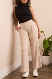 Wide-leg flowy pants in with a smooth waistband and soft drape.