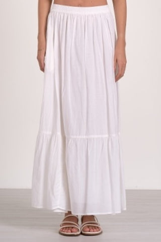 White tiered midi skirt with pockets and elastic waistband.