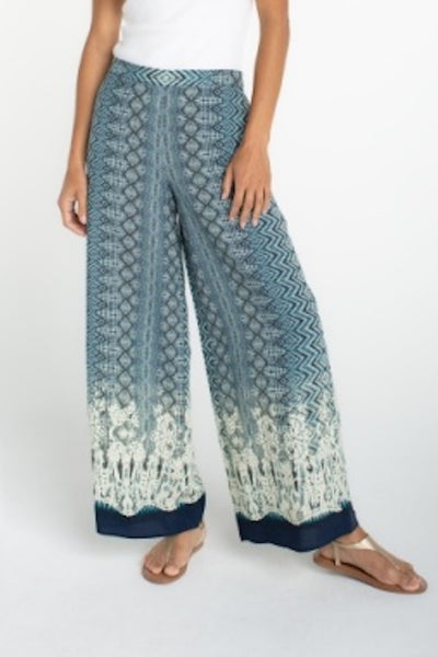 Front view of Liverpool palazzo pants with blue geometric ombré print on model.