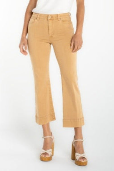 Hannah crop flare hugger jeans with cut hem, front view, paired with platform sandals and white top.