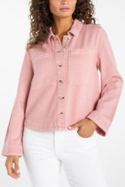 Misty blush pink high-low denim shacket with button front and curved hem, front view, paired with white jeans.