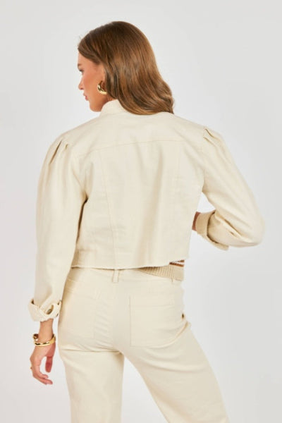 Back view of Sadie and Sage Clear Eyes denim jacket in cream showing cropped length and structured puff sleeve detail.