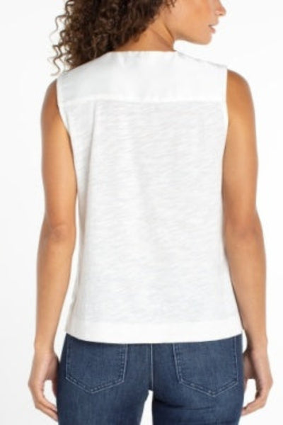 POLISHED SLEEVELESS V-NECK WOVEN-TO-KNIT TOP