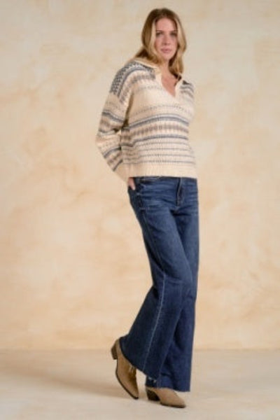 women’s V-neck collared sweater
Elan V-neck sweater
women’s collared sweater
off-white patterned sweater
tan and blue sweater for women
women’s soft knit sweater
polished casual sweater
versatile women’s sweater
V-neck sweater for work
women’s sweater for jeans
Side view of Elan off-white V-neck collared sweater styled with wide-leg jeans and ankle boots