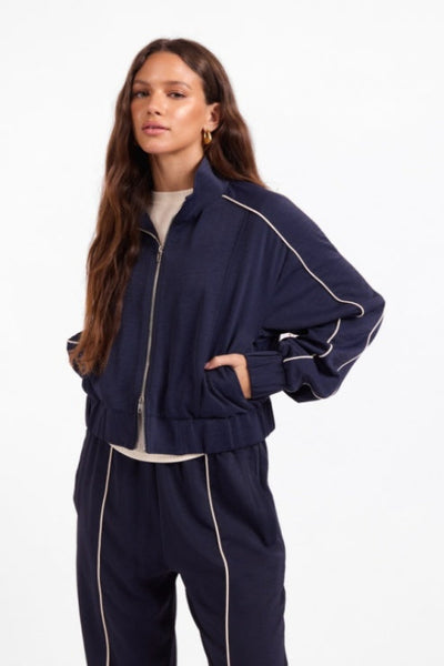 Front view of Sage the Label Bike Ride navy and ivory cropped track jacket.Sage the Label Bike Ride Track Jacket
Sage the Label navy track jacket
women’s navy and ivory track jacket
women’s cropped track jacket
navy jacket with ivory piping
sporty chic jacket for women
women’s matching track set
relaxed fit zip-front jacket
women’s boutique athleisure jacket
navy cropped lightweight jacket