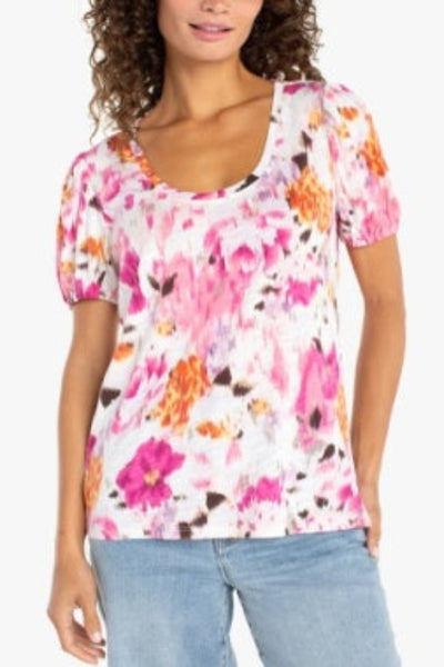 Multicolor floral puff sleeve knit top with pink and orange blooms, scoop neckline, front view, paired with blue jeans.