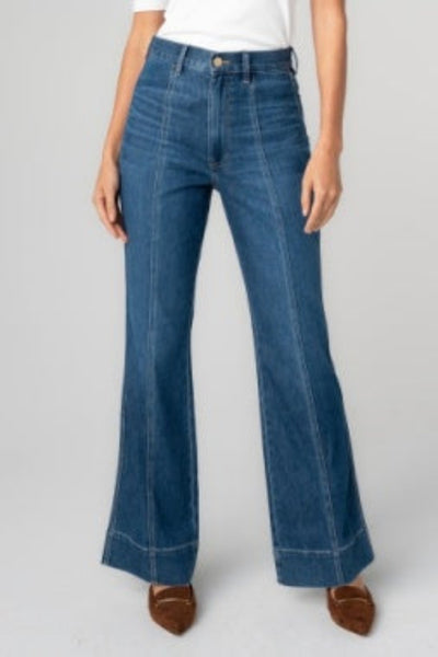 Liverpool Relaxed High Rise Seamed Bootcut Jeans in bayshore medium wash, high-rise waist, front seam detail, bootcut silhouette with 22" leg opening, 30" inseam — front view on model styled with brown mules.