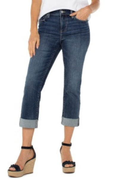Charlie Crop mid-rise jeans with wide rolled cuff in dark wash denim, paired with white tee and black ankle strap wedge sandals, front view
