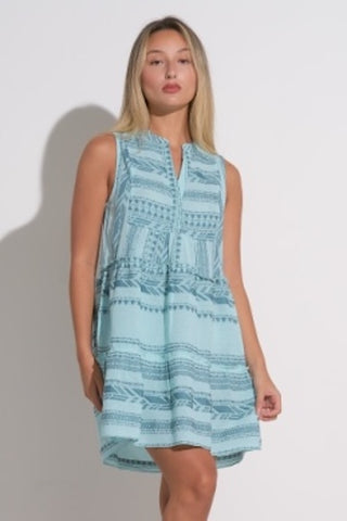 Light blue A-line sleeveless mini dress with tribal pattern and relaxed fit.