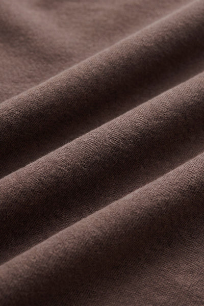 Close-up of Dark Chocolate cotton French terry fabric on the Z Supply Circuit Sweatshirt. Z Supply Circuit sweatshirt; Z Supply Dark Chocolate sweatshirt; Z Supply ZT263247; women's chocolate brown sweatshirt; women's cotton French terry sweatshirt; women's cropped crewneck sweatshirt; relaxed fit brown sweatshirt; long sleeve cotton pullover; dropped shoulder sweatshirt; Z Supply women's sweatshirt.

