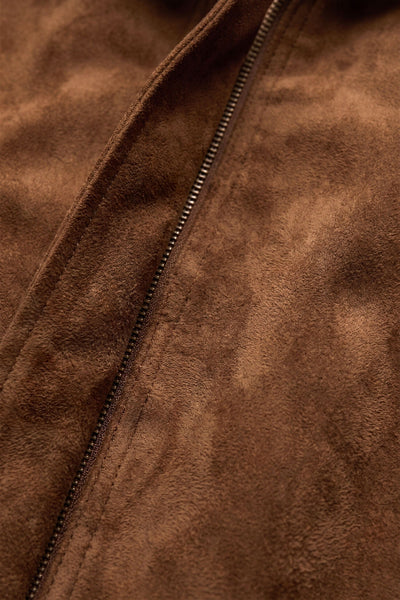 Close-up of Saddle Suede faux suede texture and zipper detail on the Z Supply Corbin Bubble Hem Jacket. Z Supply Corbin Bubble Hem Jacket; Z Supply Saddle Suede jacket; Z Supply ZJ263172; women's faux suede jacket; brown faux suede jacket; women's bubble hem jacket; cropped faux suede jacket; collared suede look jacket; women's jacket with welt pockets; long sleeve brown jacket.